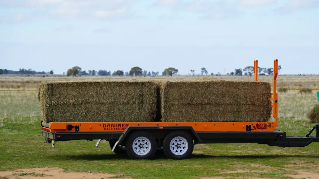 Daniher Bale Feeder unit with green conveyor belt fitted to a ute tray